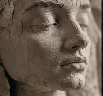 Clay sculpture, brushes in a studio, and a sculptor shaping a face.